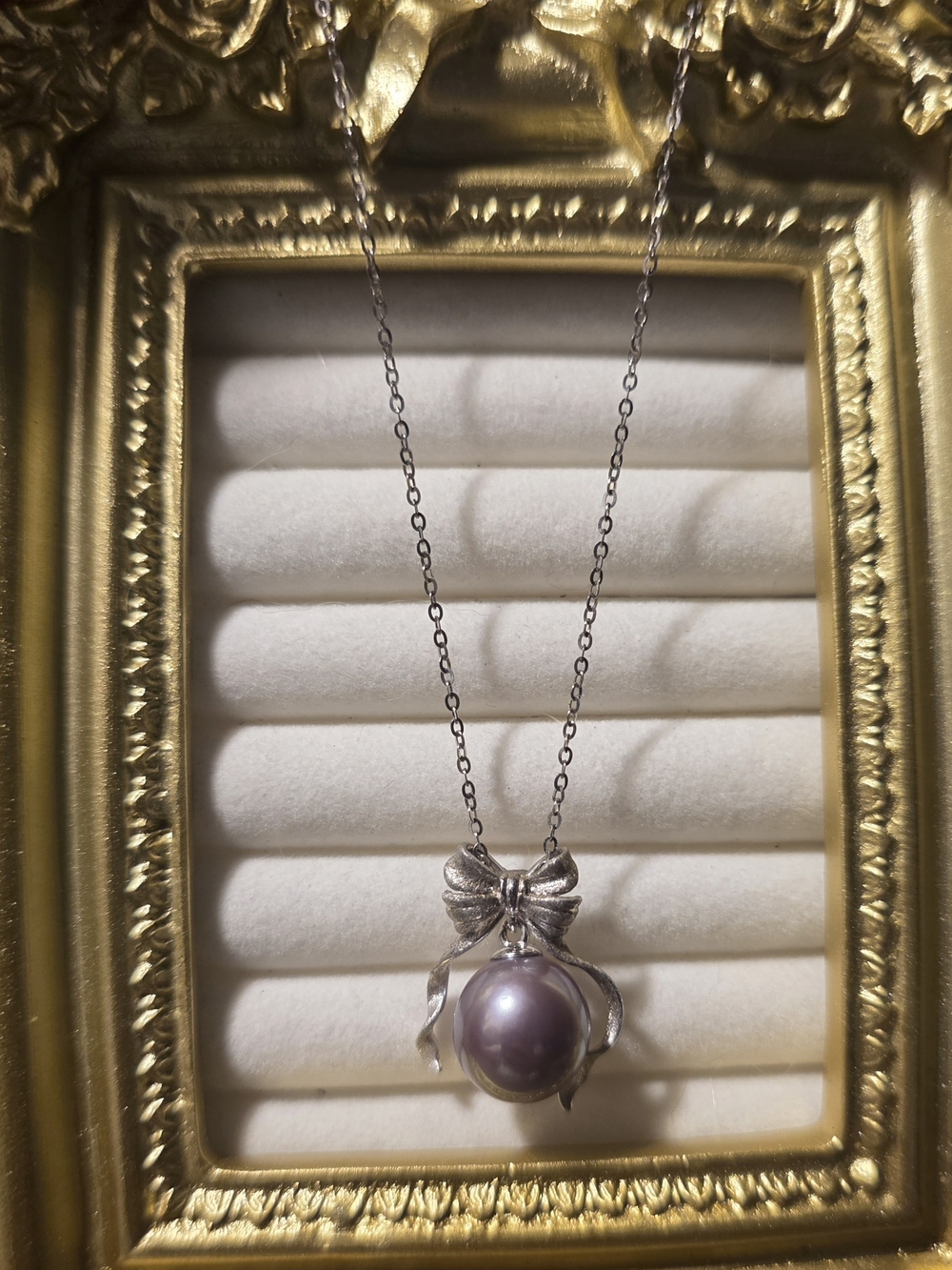 Silver Bow Pendant Necklace with Lavender Pearl